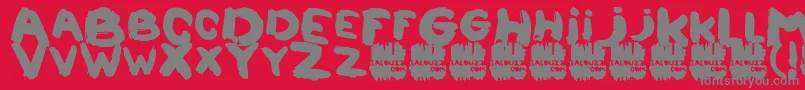 フォントLalouzz – 赤い背景に灰色の文字