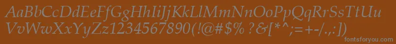 ZapfCalligraphic801ItalicSwa-fontti – harmaat kirjasimet ruskealla taustalla