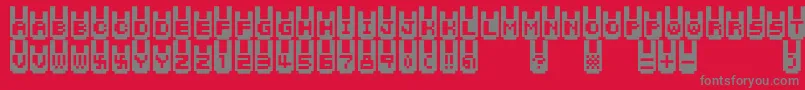 フォントRabbitbitfm – 赤い背景に灰色の文字