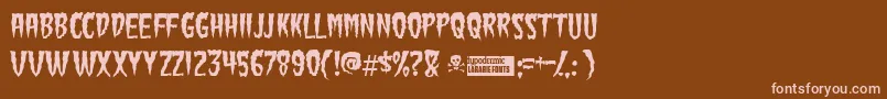 Greenfuz-Schriftart – Rosa Schriften auf braunem Hintergrund