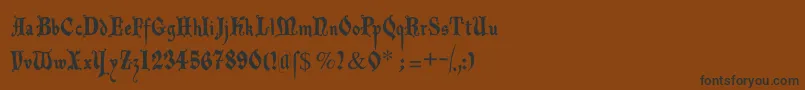 フォントDecadentafrax – 黒い文字が茶色の背景にあります