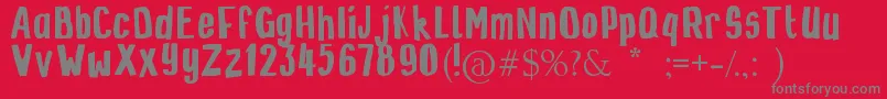 Zinzozo-fontti – harmaat kirjasimet punaisella taustalla