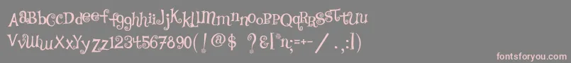 フォントTsCurly – 灰色の背景にピンクのフォント