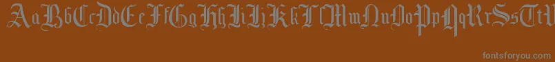 MottisfontNo1-Schriftart – Graue Schriften auf braunem Hintergrund