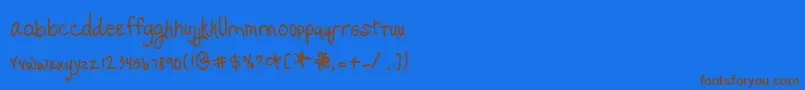 フォントPromisedFreedom – 茶色の文字が青い背景にあります。