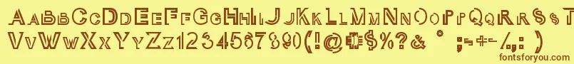 フォントOubliCap – 茶色の文字が黄色の背景にあります。