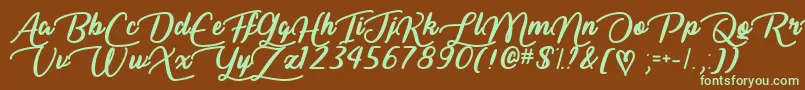フォントLiarScriptTtf – 緑色の文字が茶色の背景にあります。