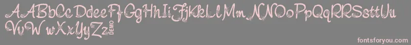 フォントNebuloDemo – 灰色の背景にピンクのフォント