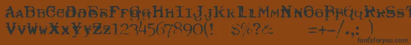 TypewriterRoyal200Trashed-Schriftart – Schwarze Schriften auf braunem Hintergrund