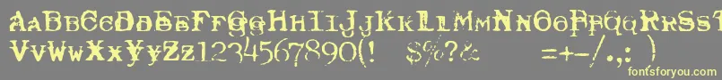 TypewriterRoyal200Trashed-fontti – keltaiset fontit harmaalla taustalla