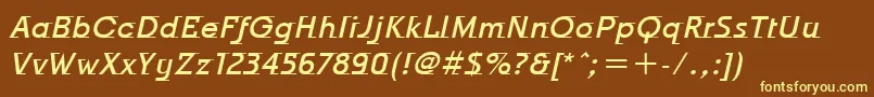 OdysseeItcMediumItalic-fontti – keltaiset fontit ruskealla taustalla