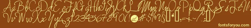 Enchantedprairiedog-fontti – keltaiset fontit ruskealla taustalla