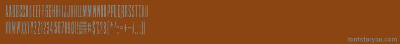 Czcionka Nollanaama – szare czcionki na brązowym tle