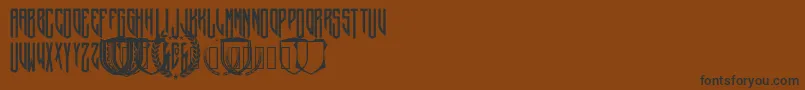 CrepitusMonogram Font – Black Fonts on Brown Background