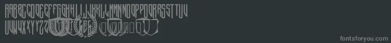 CrepitusMonogram-fontti – harmaat kirjasimet mustalla taustalla