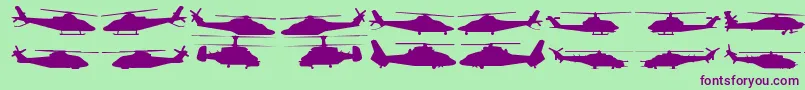 Hellocopters2-Schriftart – Violette Schriften auf grünem Hintergrund