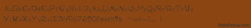 SwirlinthewonderlandRegular-Schriftart – Schwarze Schriften auf braunem Hintergrund