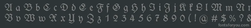 フォントWieynckfrakturGesperrtunz1l – 黒い背景に灰色の文字