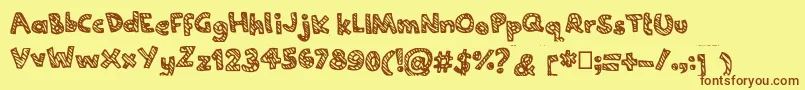 フォントJoannecandy – 茶色の文字が黄色の背景にあります。