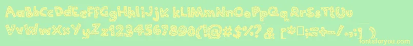 フォントJoannecandy – 黄色の文字が緑の背景にあります
