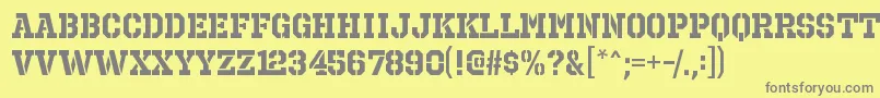 OctinprisonrgBold-fontti – harmaat kirjasimet keltaisella taustalla