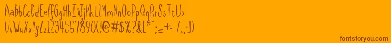 Fonte Spilmrg – fontes marrons em um fundo laranja