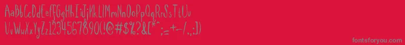 フォントSpilmrg – 赤い背景に灰色の文字