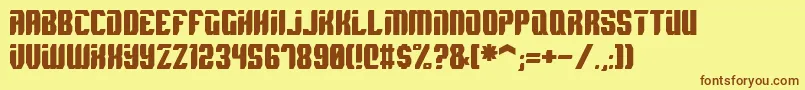 フォントSpyh – 茶色の文字が黄色の背景にあります。