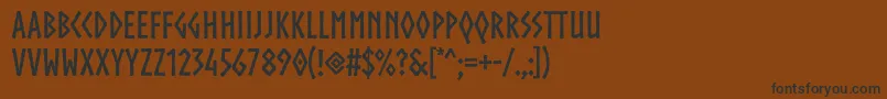 フォントNorsebold – 黒い文字が茶色の背景にあります