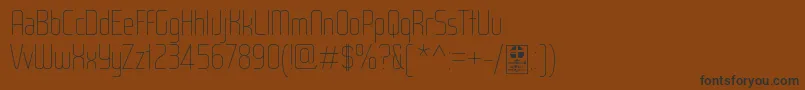 WoxModelistHairlineDemo-Schriftart – Schwarze Schriften auf braunem Hintergrund