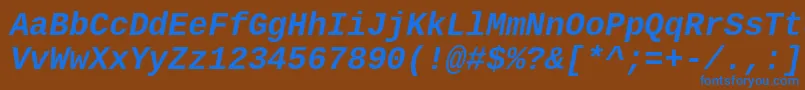 Cousine ffy Font – Blue Fonts on Brown Background