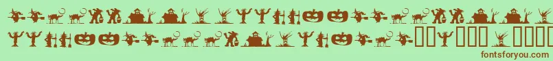 フォントSilbooettesTryout – 緑の背景に茶色のフォント
