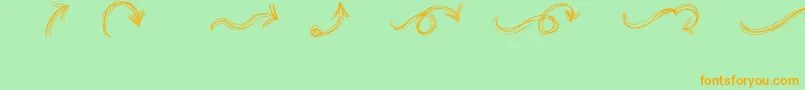 フォントGoAroundTheBooksArrows – オレンジの文字が緑の背景にあります。