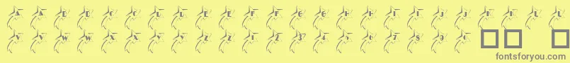 101ShootingStarz-fontti – harmaat kirjasimet keltaisella taustalla