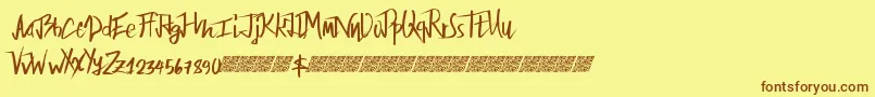 フォントFairbanks – 茶色の文字が黄色の背景にあります。