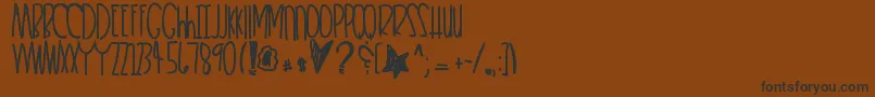 フォントHeartkeeper – 黒い文字が茶色の背景にあります