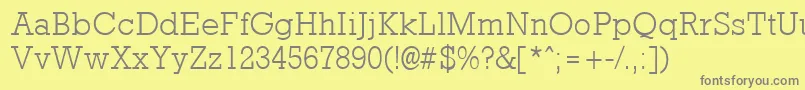 RockneyLight-fontti – harmaat kirjasimet keltaisella taustalla
