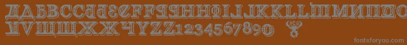 フォントKremlinGeorgianI3D – 茶色の背景に灰色の文字