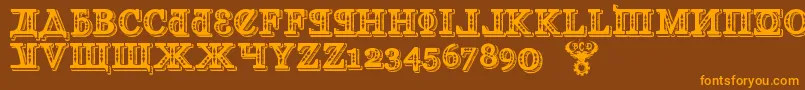 フォントKremlinGeorgianI3D – オレンジ色の文字が茶色の背景にあります。