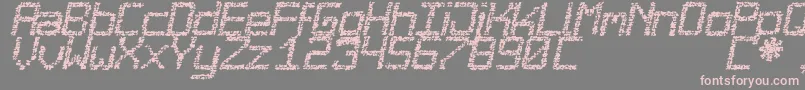 フォントDesgastada – 灰色の背景にピンクのフォント