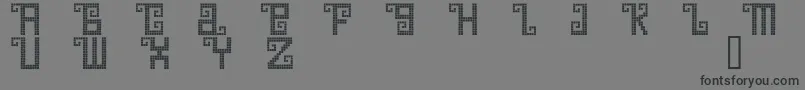 Czcionka QuetzalDemo – czarne czcionki na szarym tle