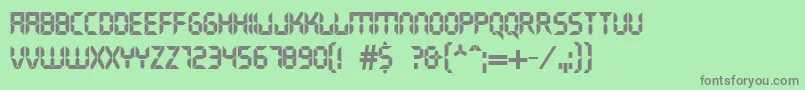 DsCrystal-fontti – harmaat kirjasimet vihreällä taustalla