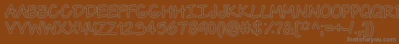 TheUrbanWayHollow-fontti – harmaat kirjasimet ruskealla taustalla