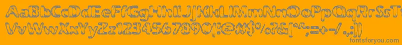 WeatheredBrk-Schriftart – Graue Schriften auf orangefarbenem Hintergrund