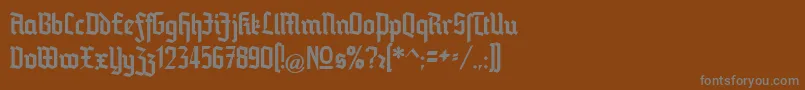 Blankenburg-fontti – harmaat kirjasimet ruskealla taustalla