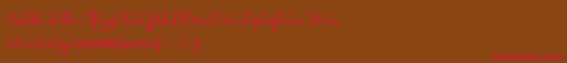 BmdJasmineReminiscentseBold-Schriftart – Rote Schriften auf braunem Hintergrund