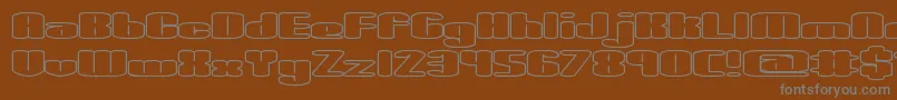 SpaciousOutlineBrk-fontti – harmaat kirjasimet ruskealla taustalla