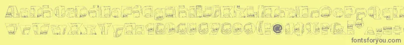 Monsterboxes-fontti – harmaat kirjasimet keltaisella taustalla