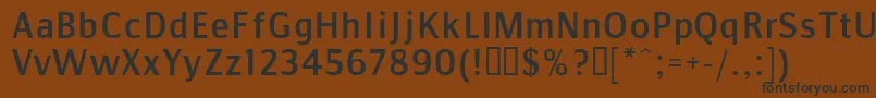 CommunistSans Font – Black Fonts on Brown Background
