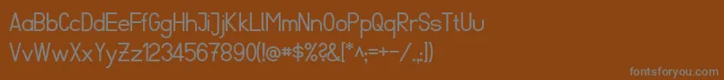 フォントFibelSued – 茶色の背景に灰色の文字